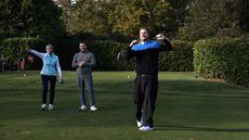 Golfers shouting fore