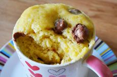 Maltesers mug cake recipe with a spoonful eaten out of it.