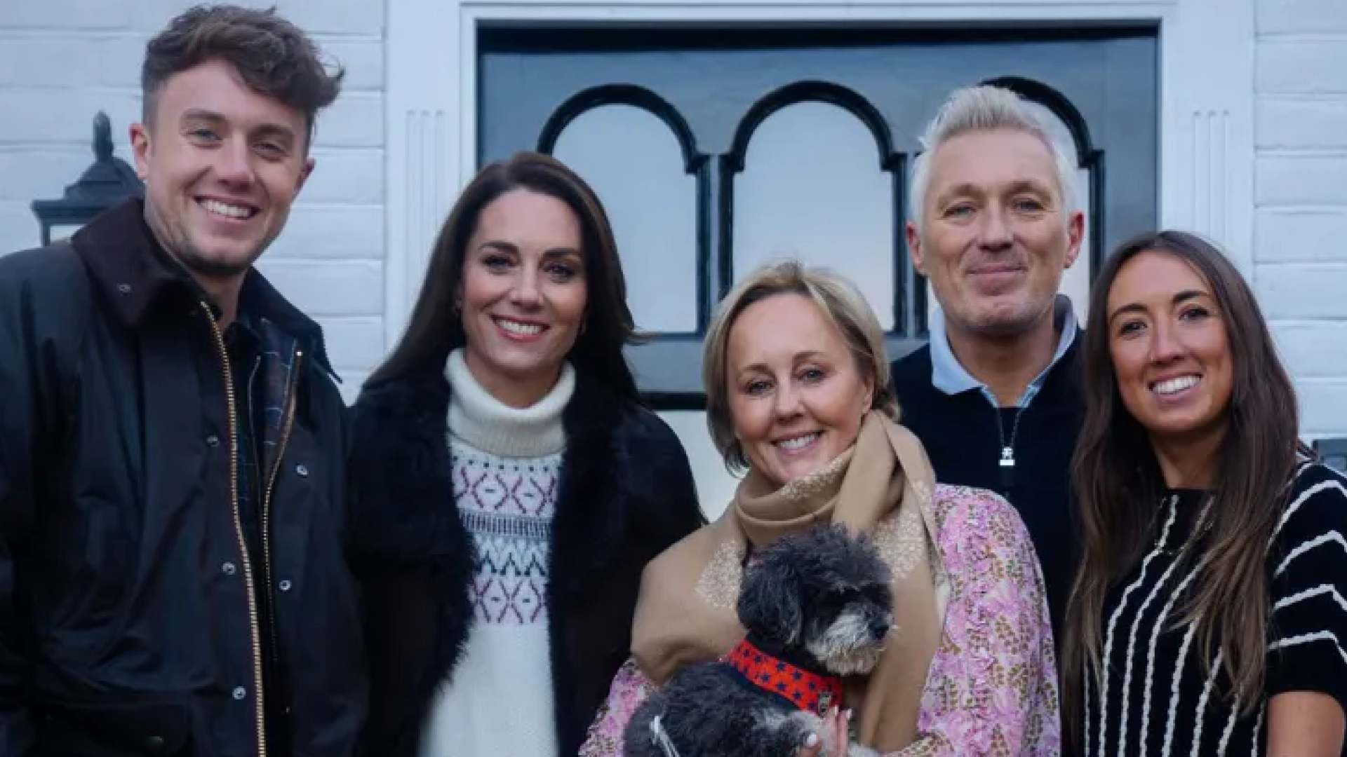 Kate Middleton posing with Martin and Roman Kemp and their family outside their house