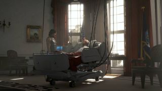 Sam Bridges (Reedus) talks to 'Bridget' (Lindsay Wagner) in the Bridges headquarters / presidential office.