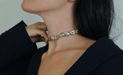 Woman wearing pearl choker