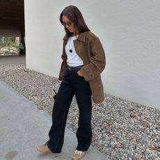 Deborah wearing suede trainers