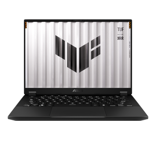 An open and powered on black laptop with a black keyboard displays the Asus TUF logo across the side of what looks like a white shipping container.