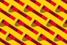 Red tape with Danger written on it with bright yellow background