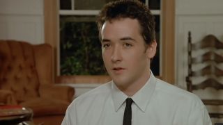 John Cusack in a white shirt and a very skinny black tie at dinner in Say Anything