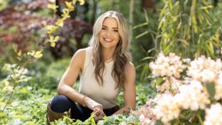 Helen Skelton outdoors in a white top, jeans and boots for Summer on the Farm 2022