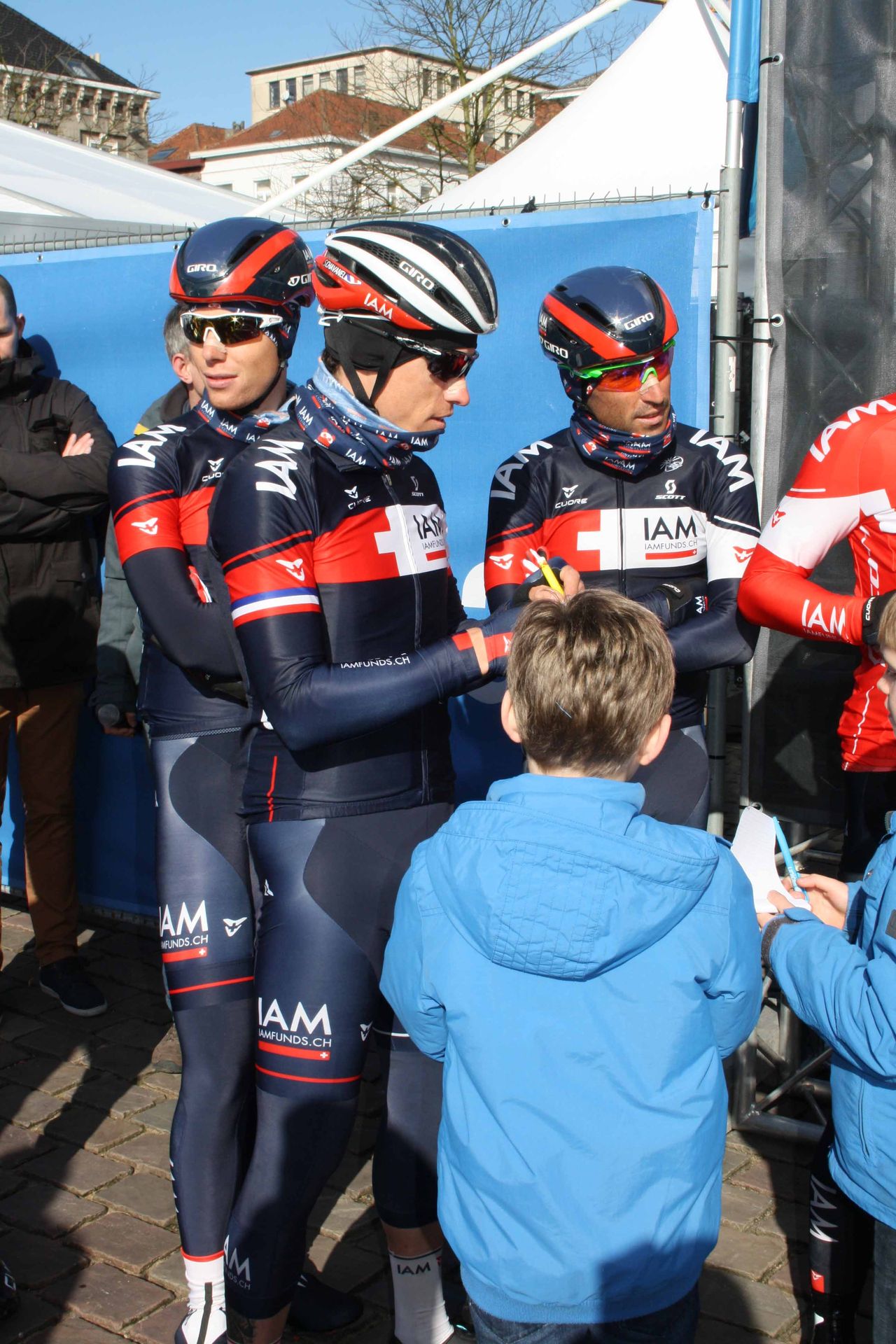 Sylvain Chavanel (IAM Cycling) signs an autograph for a young fan.