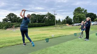 PGA pro Katie Dawkins teaching female junior golfers