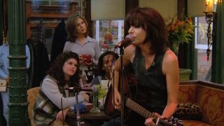 Chrissie Hynde performs with her guitar in the Central Perk on Friends