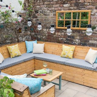 Built in wooden corner outdoor sofa with seat and back cushions