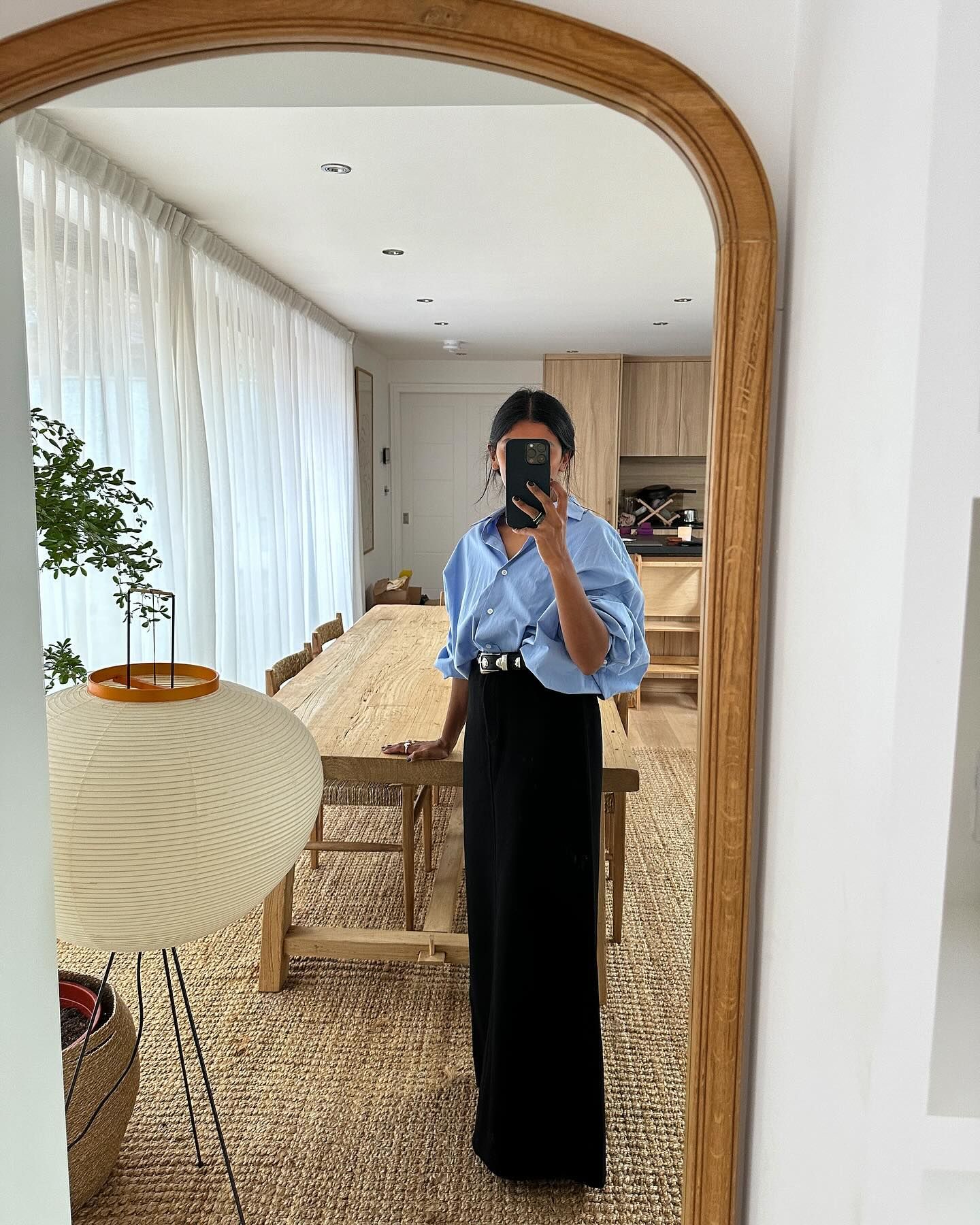 A picture of the best skirts for petites, as styled on @monikh.