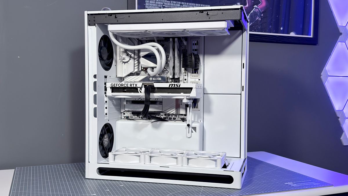 The Havn HS 360 PC case in black and white on a desk.
