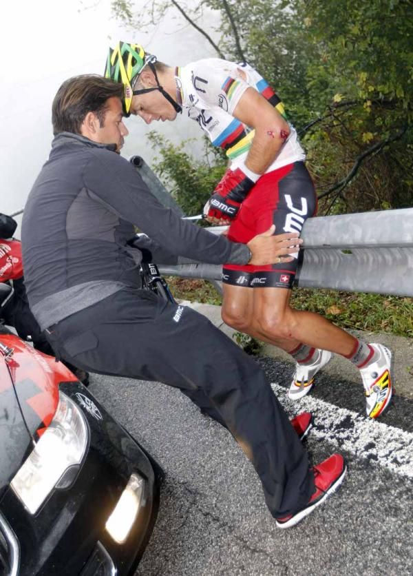 Philippe Gilbert (BMC Racing Team) is checked over by