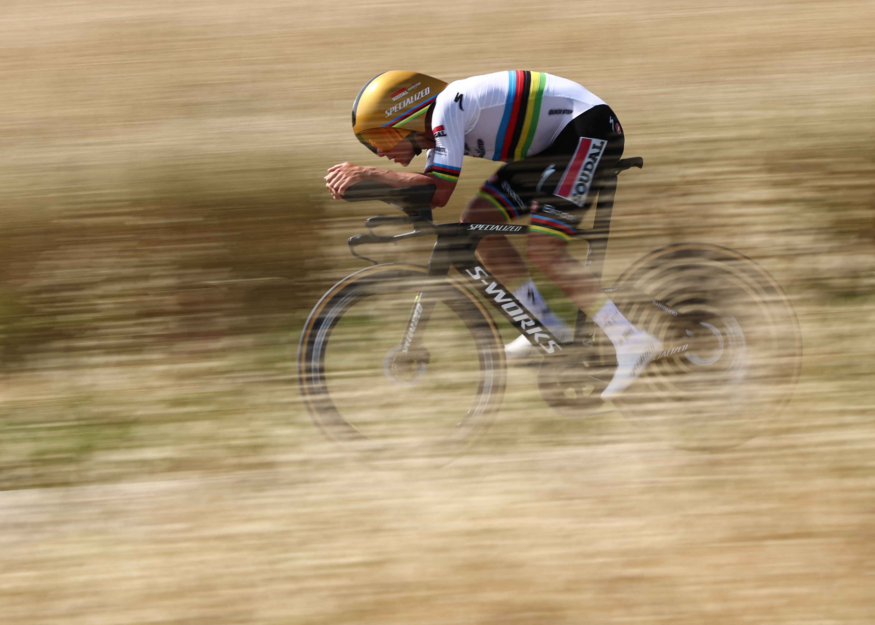 Soudal Quick-Step&#039;s Belgian rider Remco Evenepoel cycles during the 4th stage of the 77th edition of the Criterium du Dauphine cycling race, a 17,4 km individual time trial between Charmes-sur-Rhône and Saint-Péray, on June 11, 2025. (Photo by Anne-Christine POUJOULAT / AFP) (Photo by ANNE-CHRISTINE POUJOULAT/AFP via Getty Images)