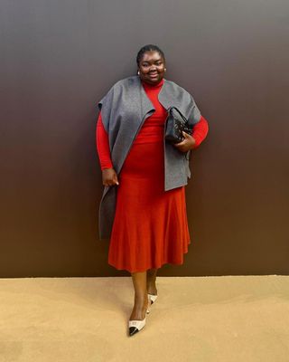 Abi wearing red and grey outfit