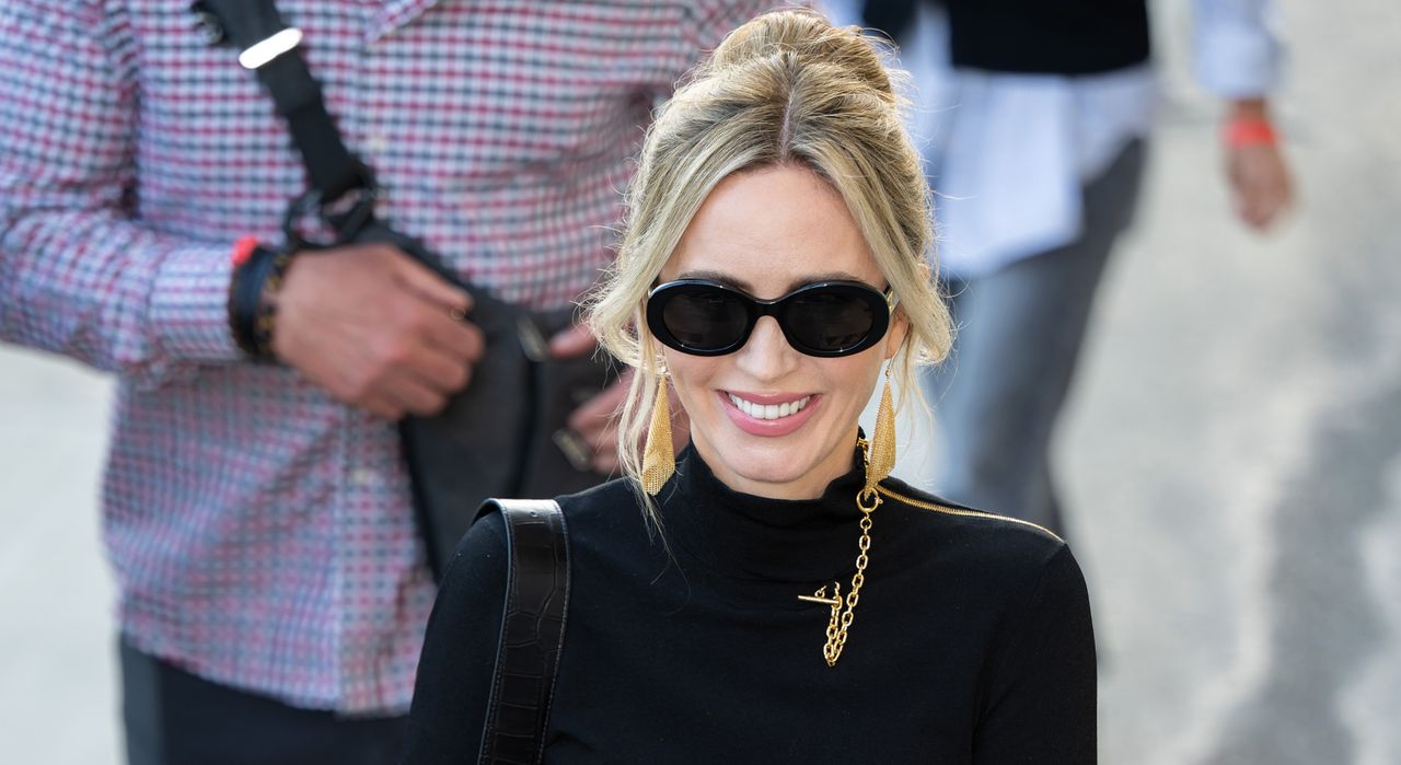 Emily Blunt wearing chain sunglasses and a black turtleneck while walking in Los Angeles