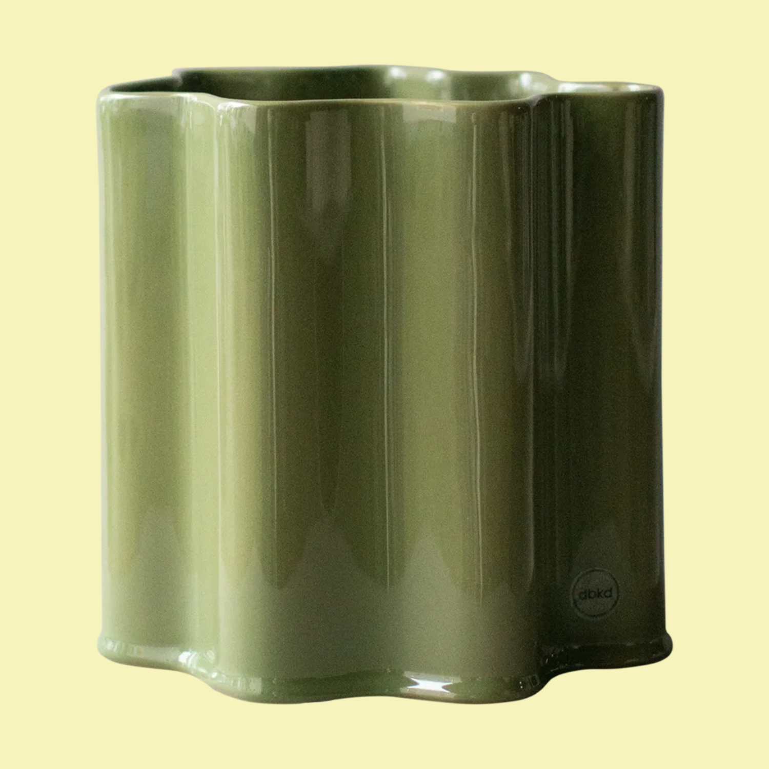 A ruffled green flower pot