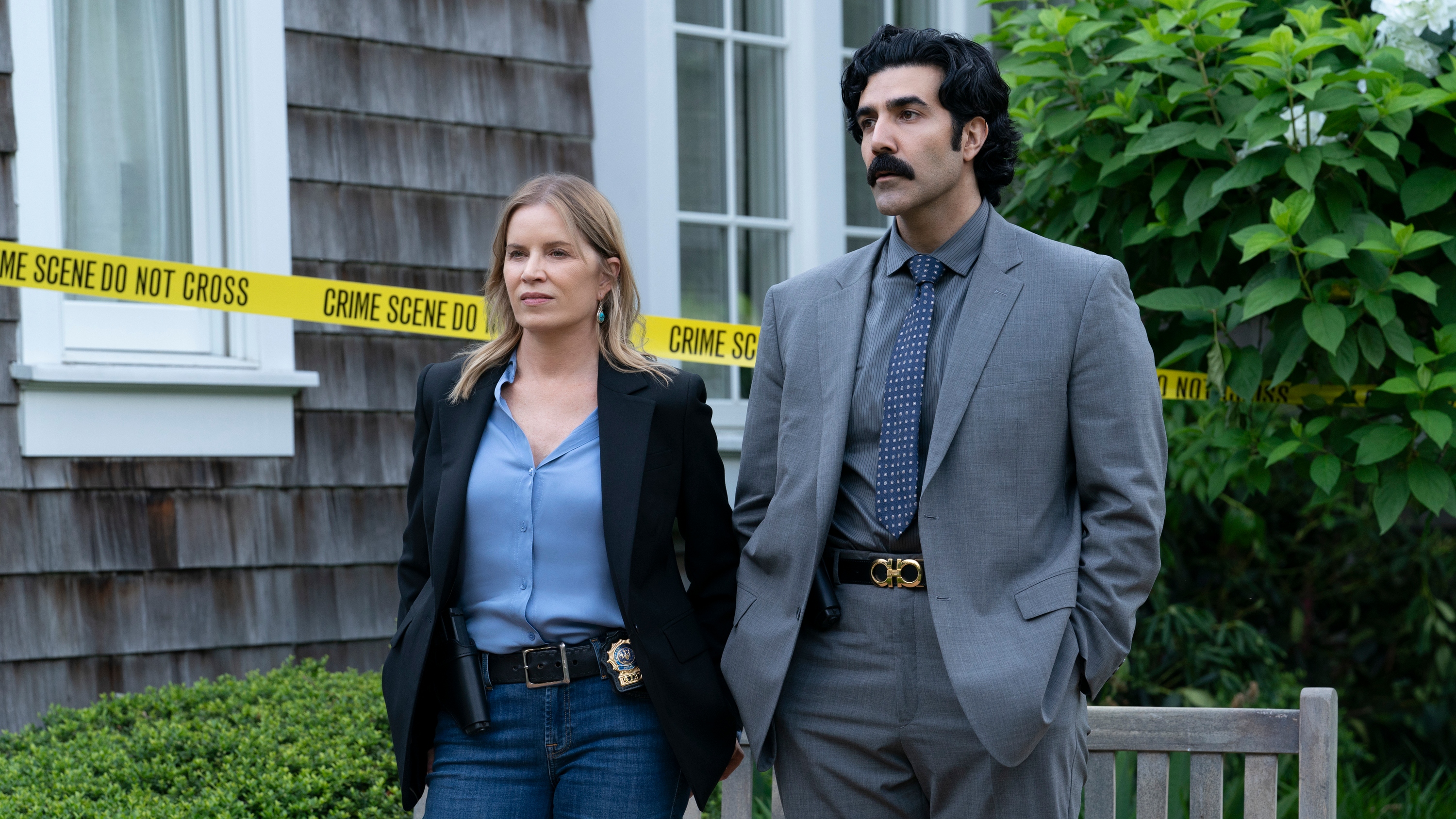 Nancy and Matt standing outside Chloe's house, which is covered in police crime tape