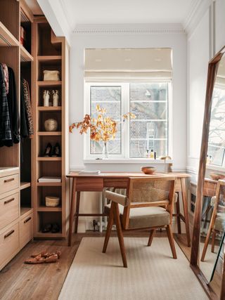 A home office and walk in wardrobe living space featuring a neutral palette in a London flat