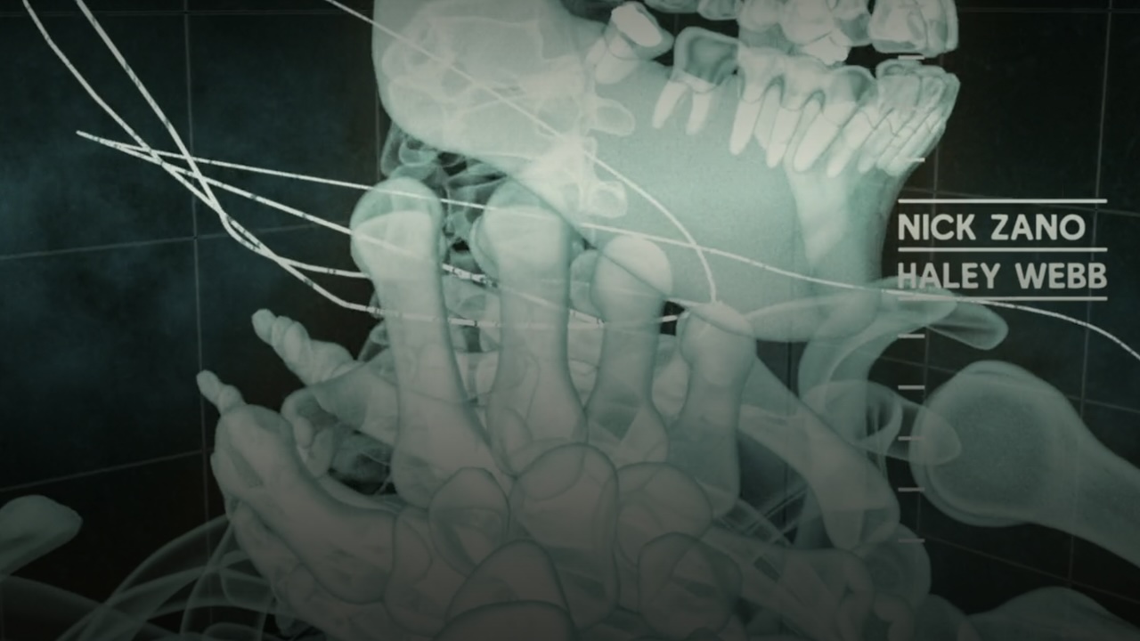 A frame from the opening credits of The Final destination, showing an X-ray view of a string around a person's neck.