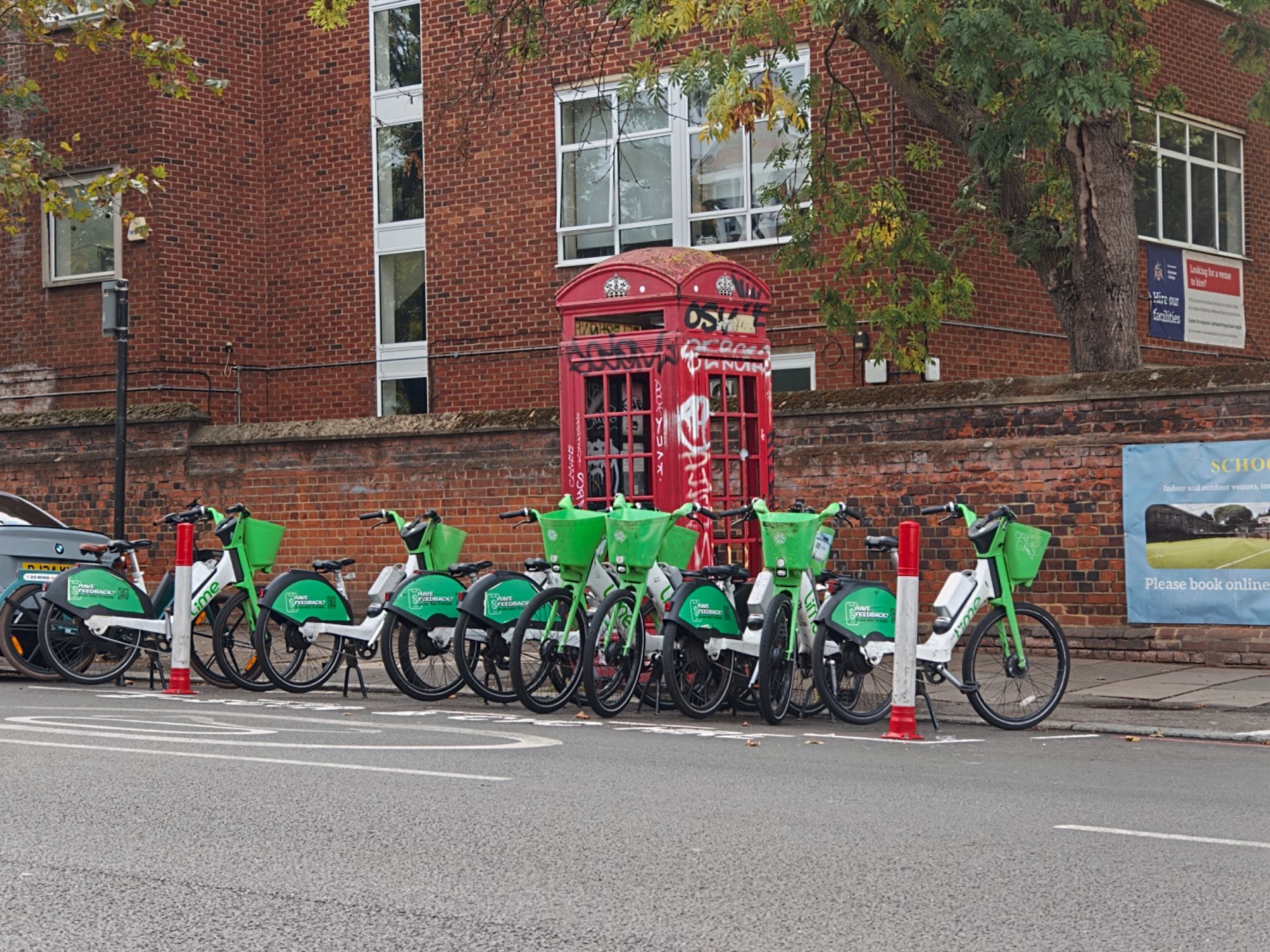 A phone box surrounded by Lime Bikes