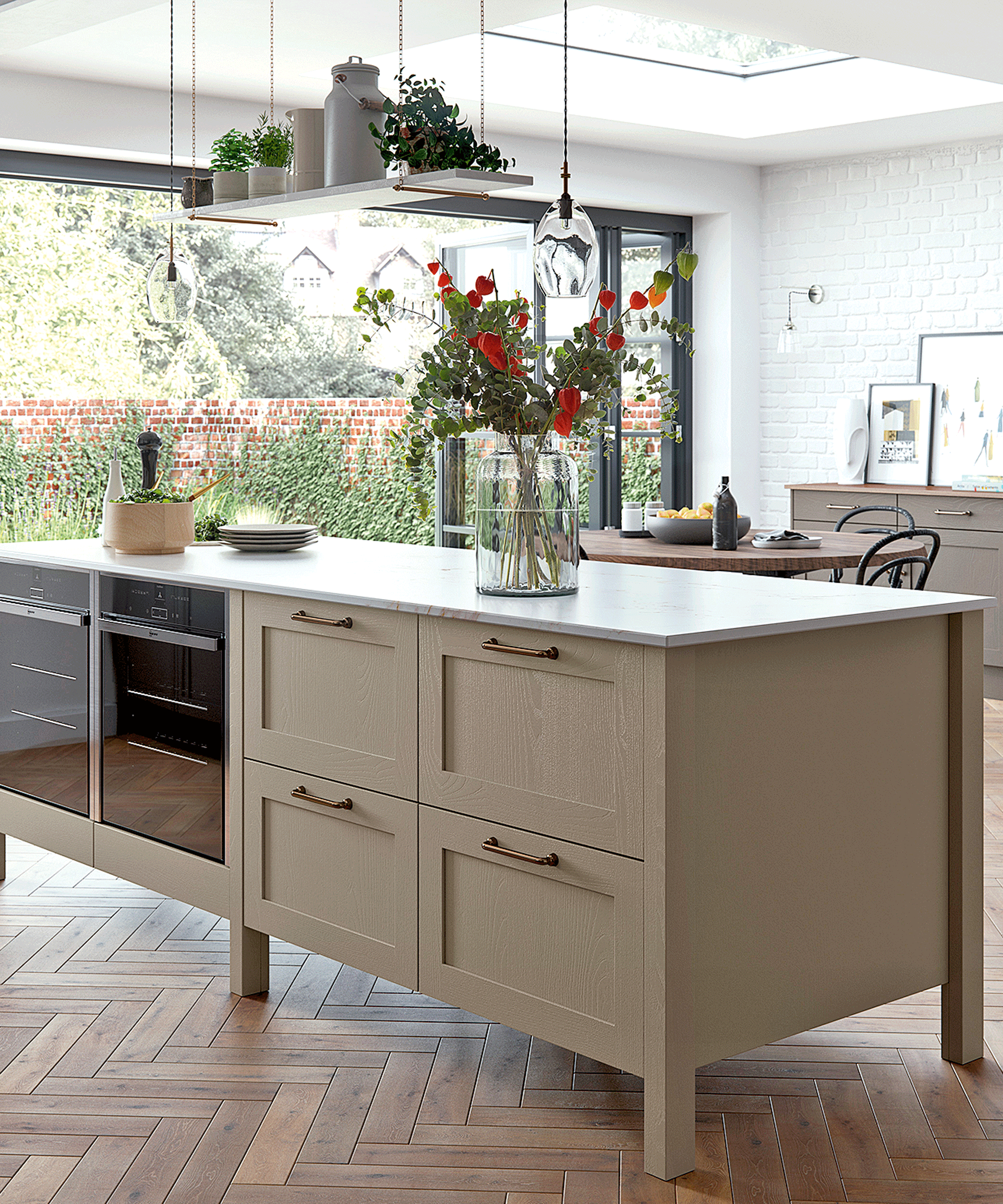 An example of freestanding kitchens showing a neutral kitchen island on legs with herringbone flooring