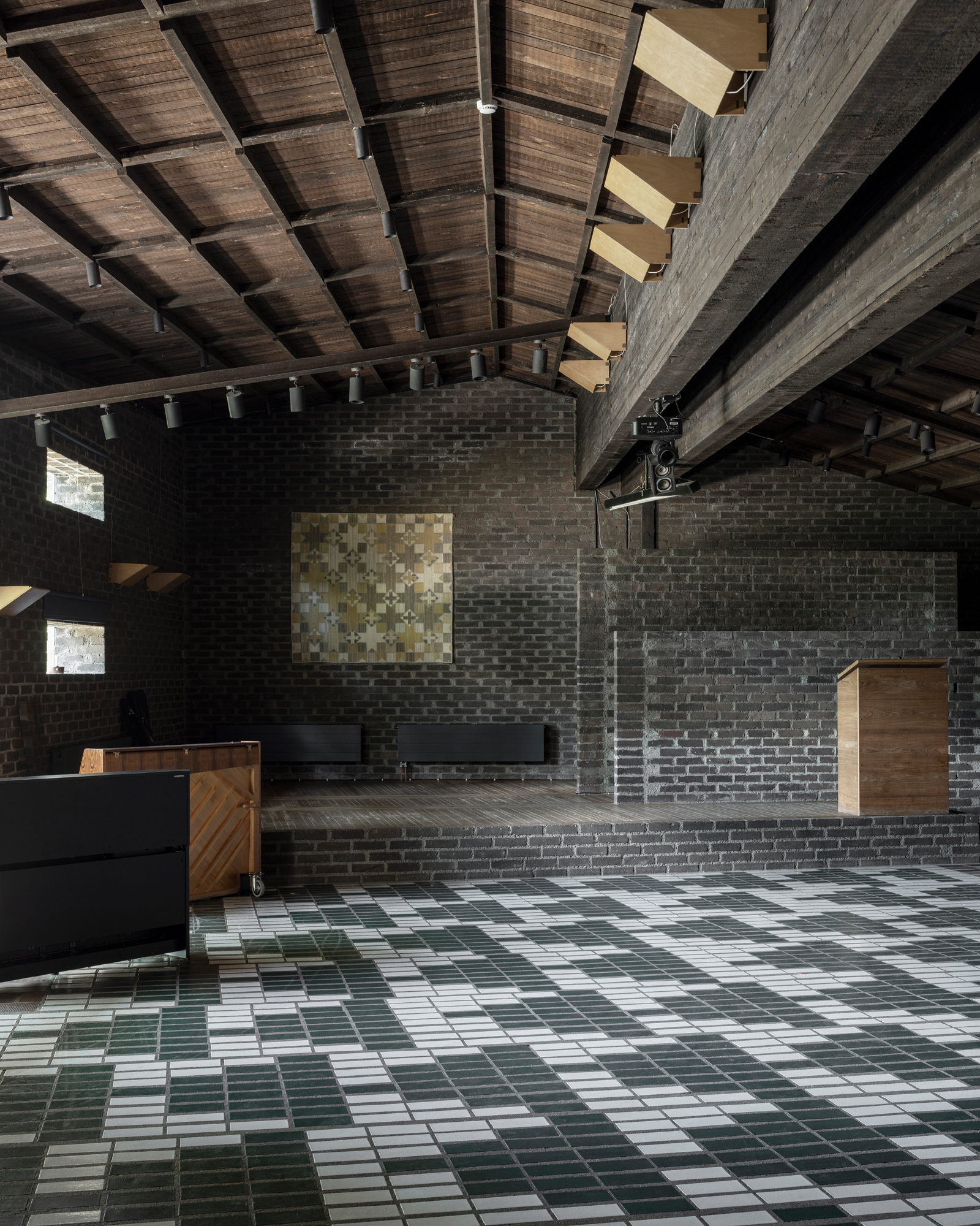 Dark interior of church with monochrome tiled floor