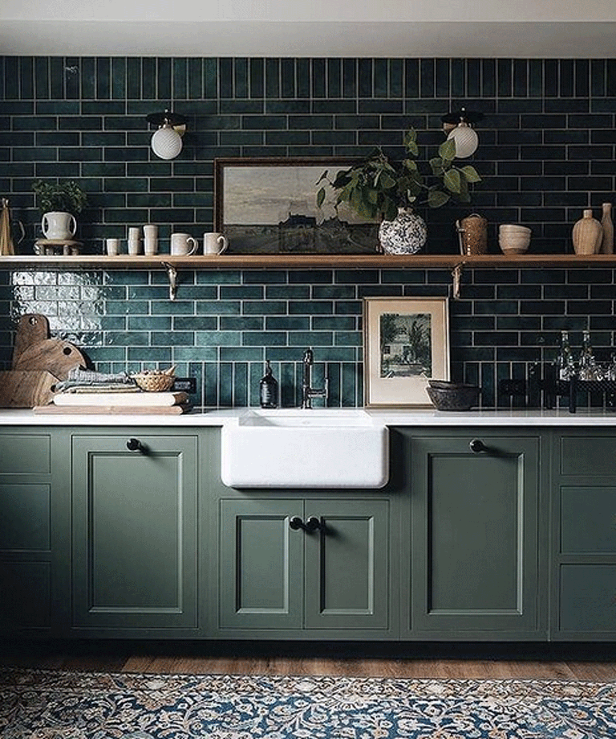 Kitchen with green tiles and green cabinetry