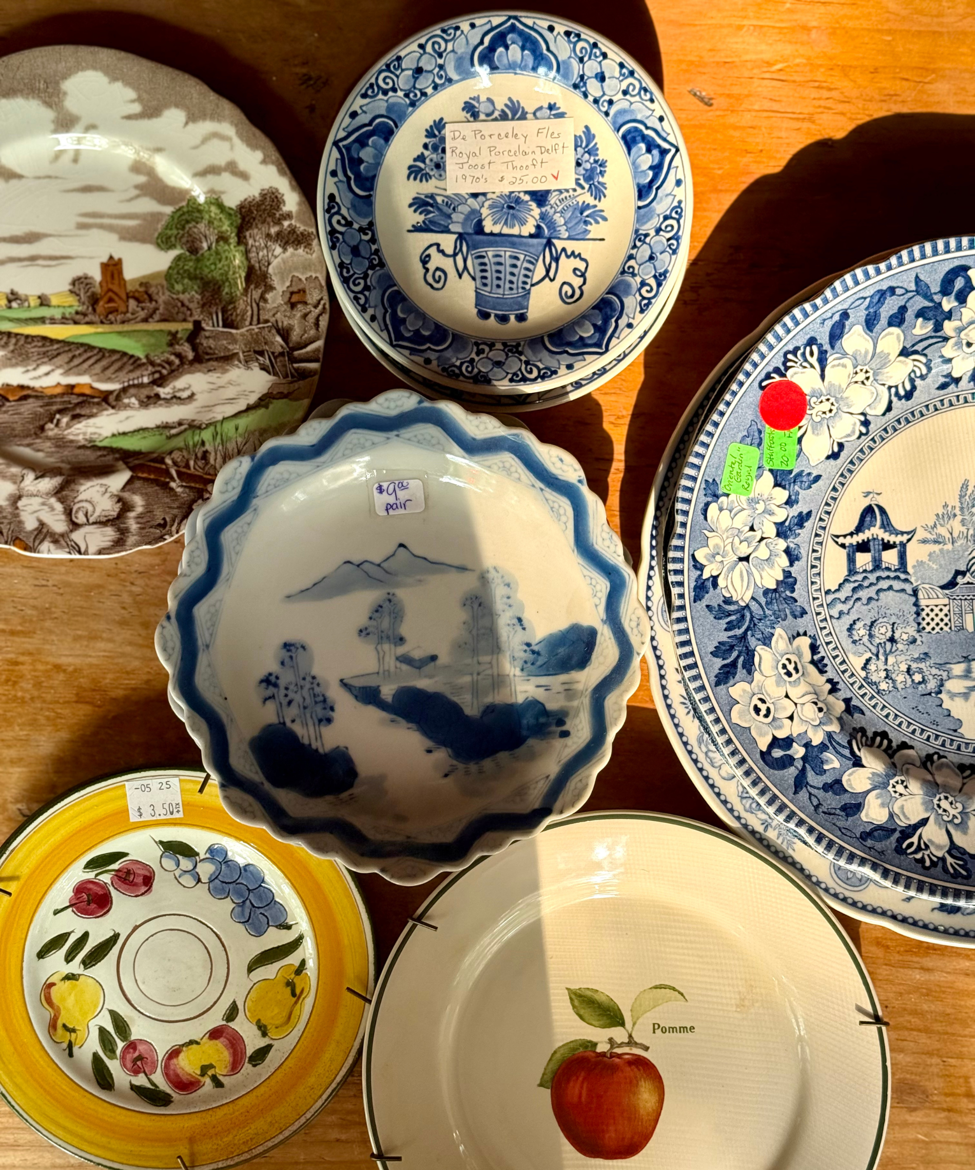 a collection of vintage plates