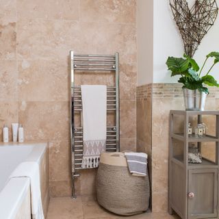 bathroom with tiles wall and bathtub