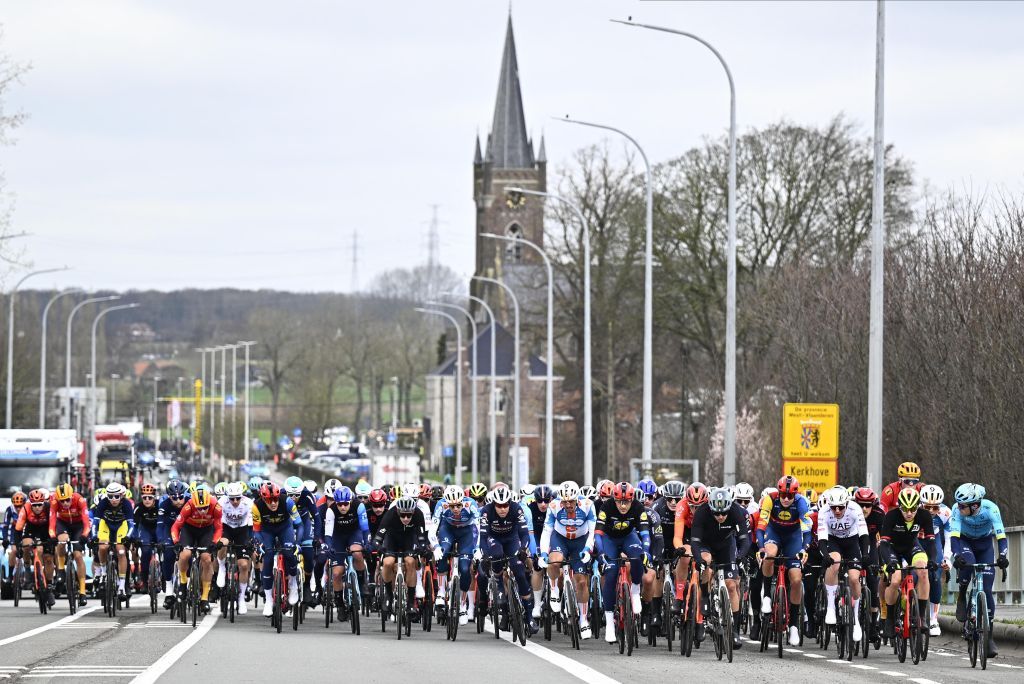 The pack rides during the Kuurne-Brussels-Kuurne one day cycling race, 196,4 km from Kuurne to Kuurne via Brussels, in Kortrijk on February 25, 2024. (Photo by JASPER JACOBS / Belga / AFP) / Belgium OUT