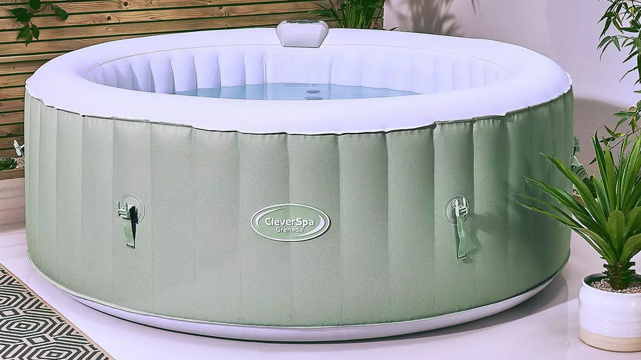 Green hot tub filled with water