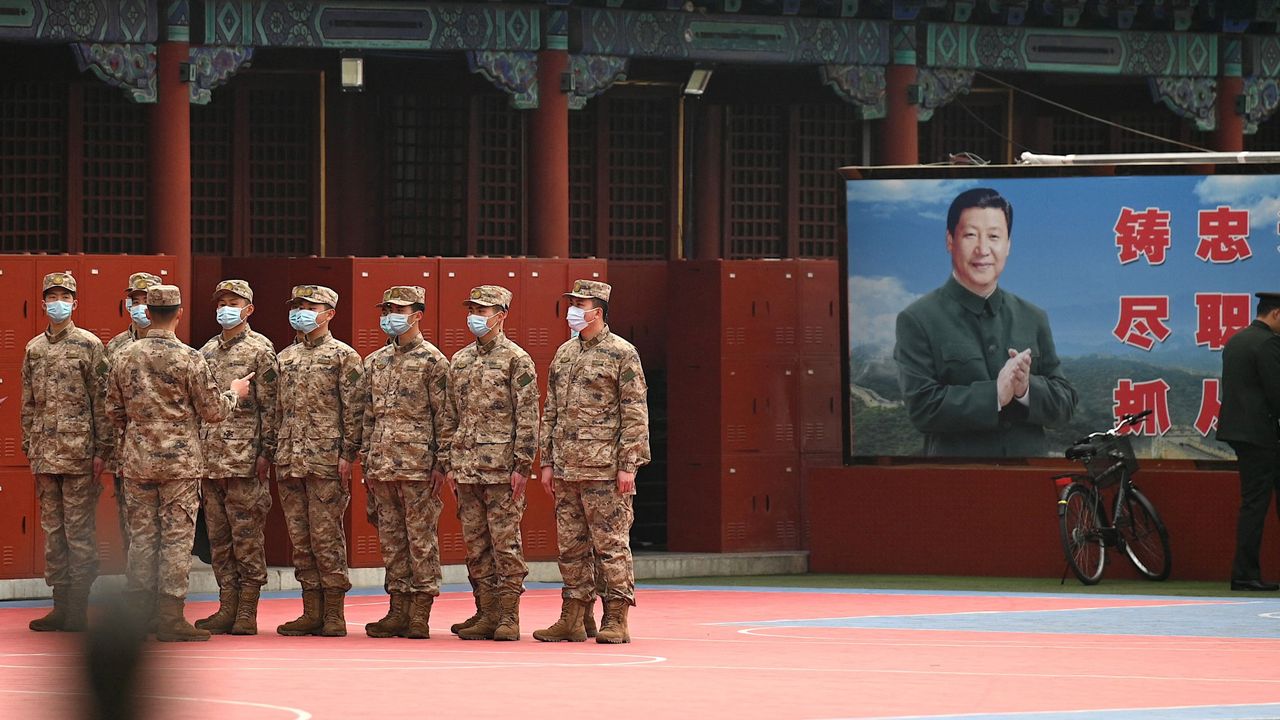 Chinese troops stand guard at the Forbidden City, Beijing