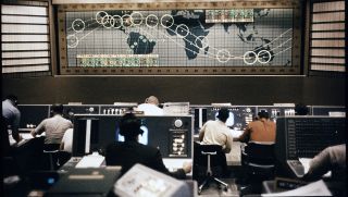 A view inside NASA's Mercury Control Center at Cape Canaveral, Florida during a Mercury orbital mission.