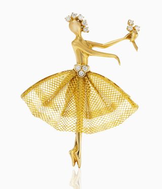 Ballerina in gold with a gold mesh skirt