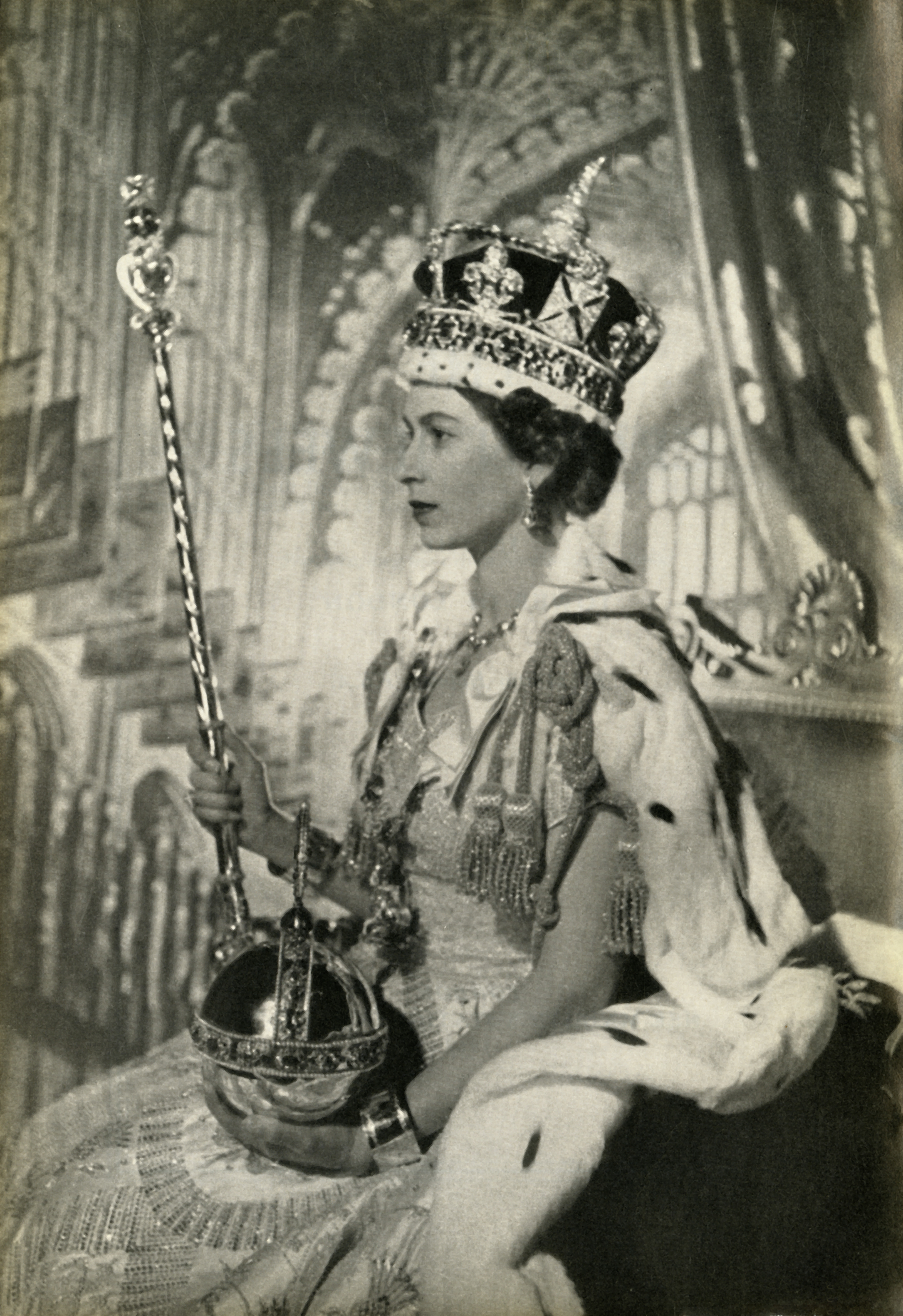 Elizabeth II at her Coronation, photographed side on holding the Sovereign's Sceptre with Cross and the Sovereign's Orb