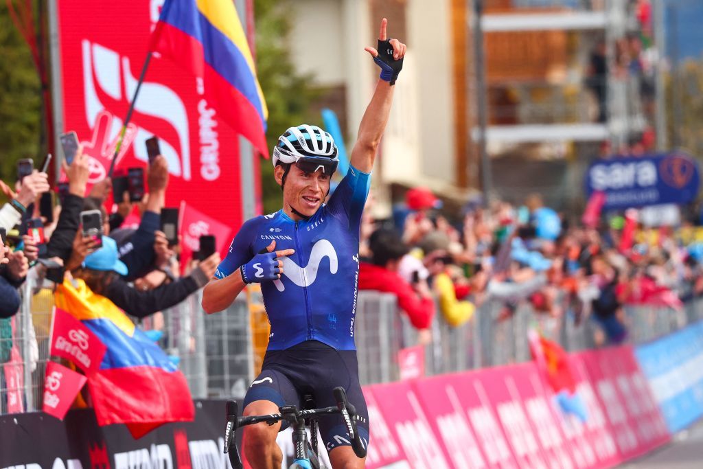 Movistar Teams Colombian rider Einer Rubio celebrates as he crosses the finish line to win the thirteenth stage of the Giro dItalia 2023 cycling race which start was transfered from Borgofranco dIvrea to Le Chable in Switzerland due to bad weather conditions and CransMontana on May 19 2023 Photo by Luca Bettini AFP Photo by LUCA BETTINIAFP via Getty Images