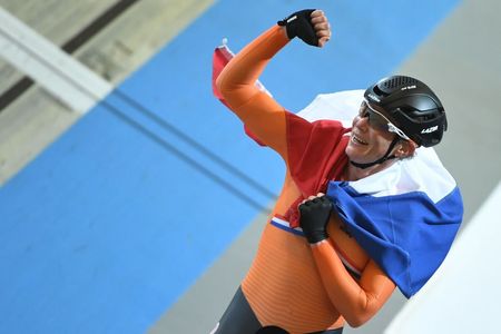 Kirsten Wild (Netherlands) celebrates the win in the points race