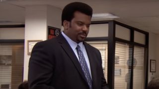 Darryl wearing a suit in the office