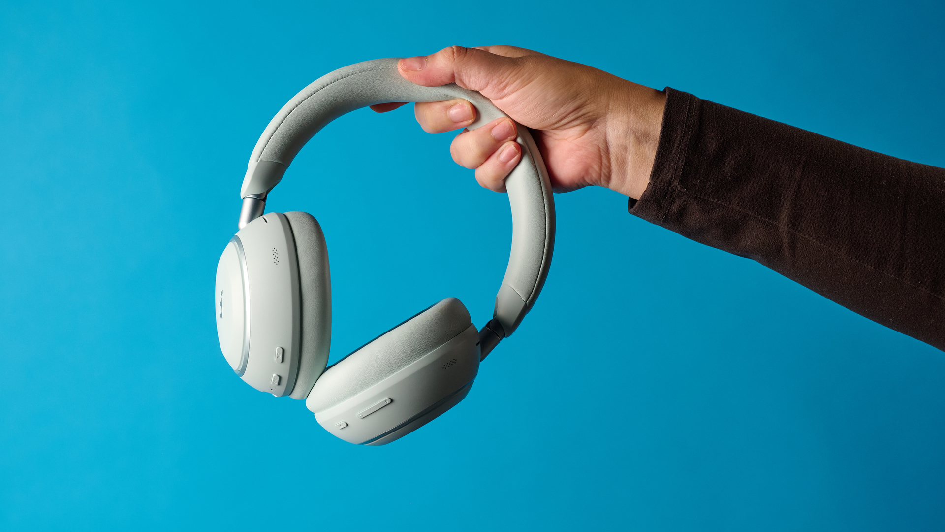 the soundcore space 2 headphones in white photographed against a blue tom's guide background
