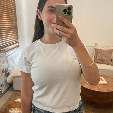 An image of Who What Wear fashion writer @avahgilchrist wearing one of the best denim shorts for women in 2026.