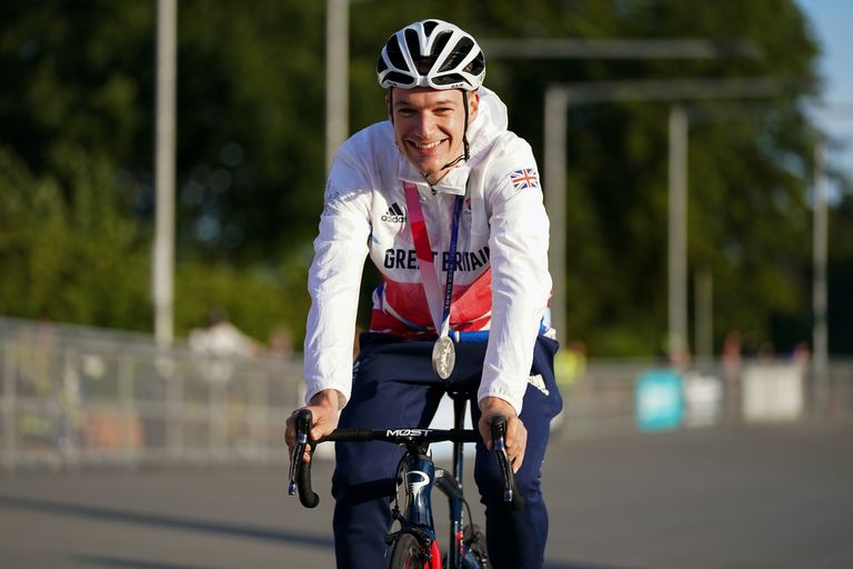 Ethan Hayter celebrating his Olympic medal at Herne Hill Velodrome, where he grew up racing
