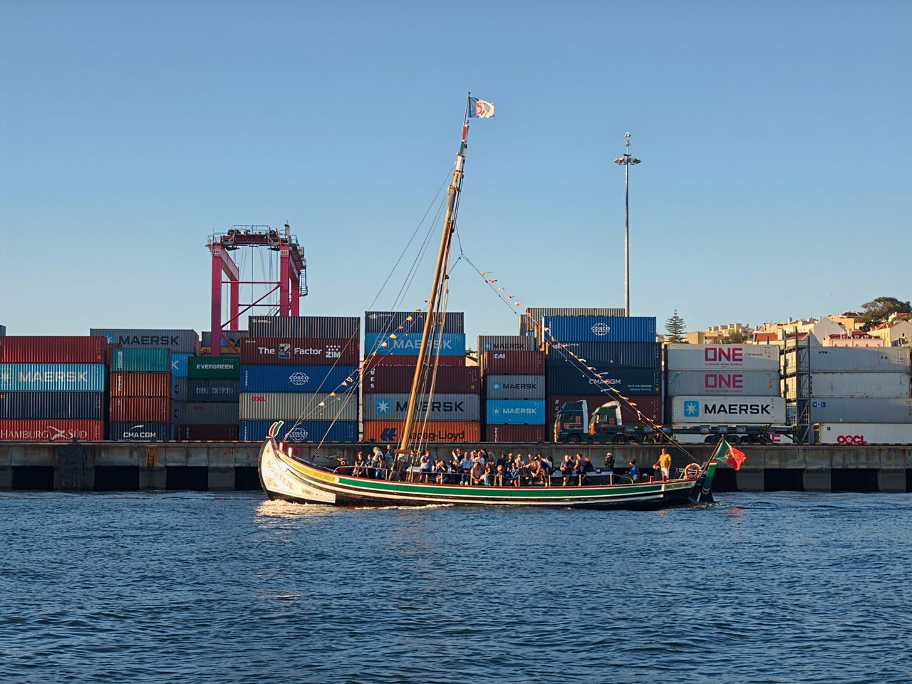 Oppo Find X10 Pro Max image sample gallery: boat on the water, infront of containers on land