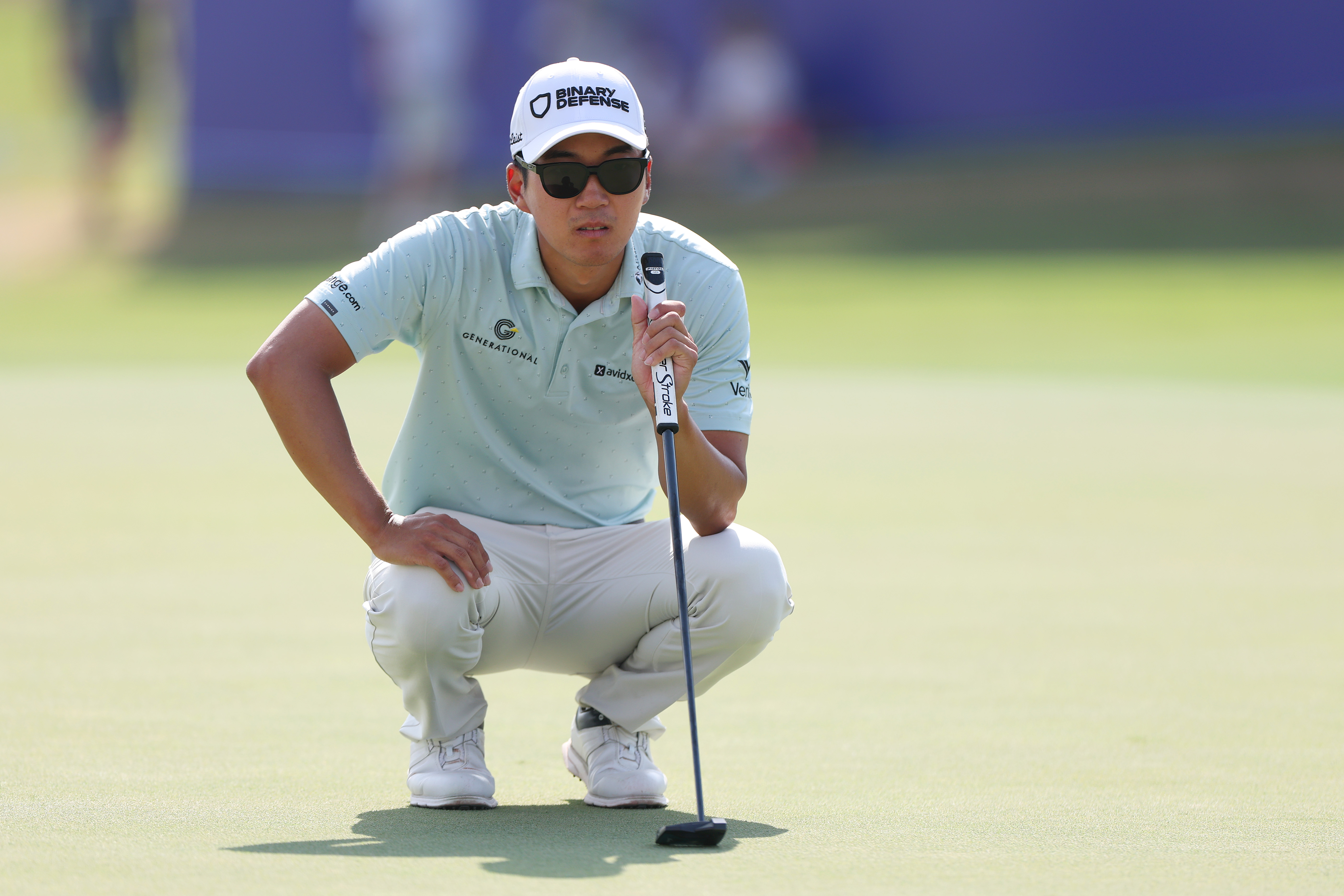Michael Kim on the green with his zero torque putter