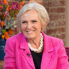 mary berry with pink coat and wearing necklace 