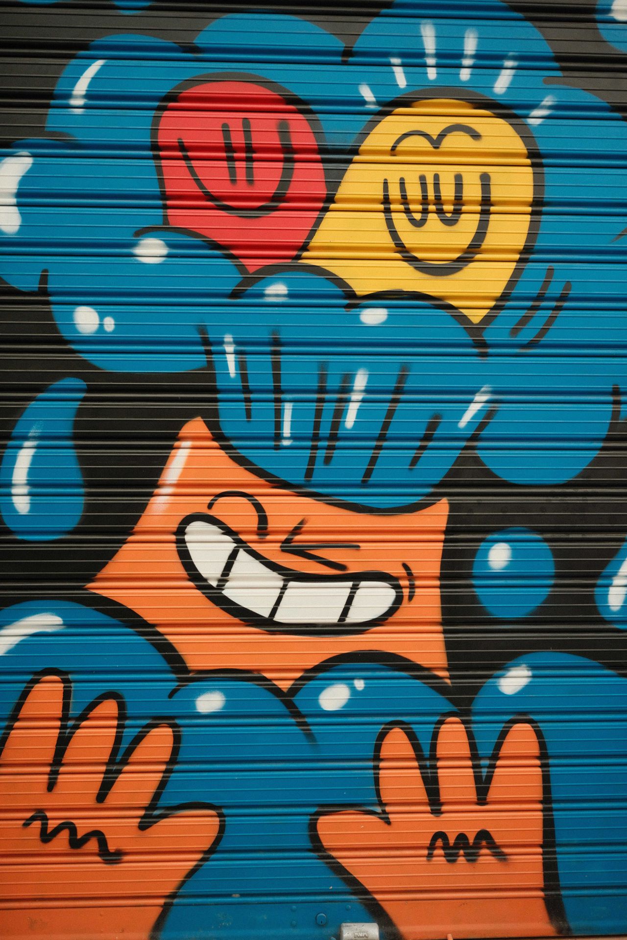 Colourful grafitti on a metal shutter