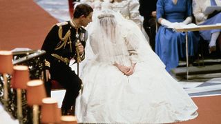 Prince Charles and Lady Diana Spencer, sitting and whispering to each other during their wedding ceremony at at St Paul's Cathedral, London, 27th July 1981.
