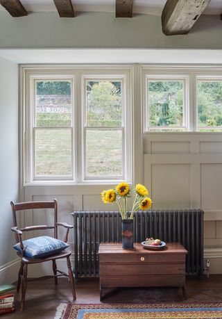 chair next to radiator by window in period home
