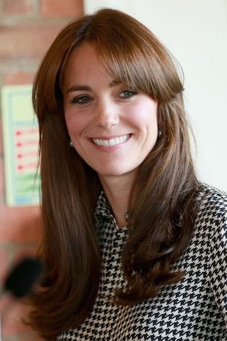 Kate Middleton headshot with a 70s bangs hairstyle