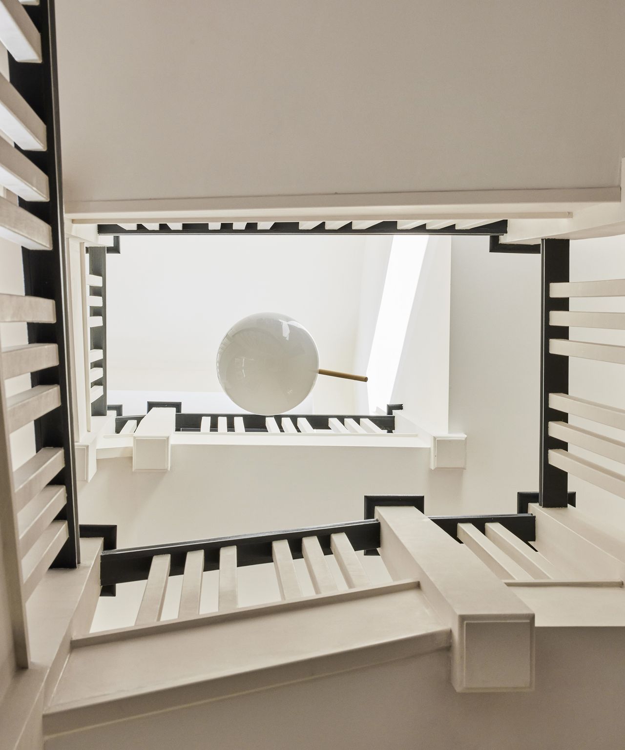 View up a staircase in the middle of a house renovation
